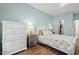 Bedroom with a white dresser and wood floors at 503 20Th Ave. N # 55B, North Myrtle Beach, SC 29582