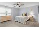 This brightly lit bedroom has a ceiling fan and a comfortable bed next to a wicker nightstand at 503 20Th Ave. N # 55B, North Myrtle Beach, SC 29582
