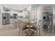 Open concept dining area showcasing a table with chairs, bright light, and a view of the kitchen at 503 20Th Ave. N # 55B, North Myrtle Beach, SC 29582