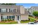 Charming two-story townhouse with black shutters, well-maintained landscaping, and a welcoming front entrance at 503 20Th Ave. N # 55B, North Myrtle Beach, SC 29582