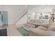 Bright living room with a staircase, wood floors, and an adjacent kitchen area at 503 20Th Ave. N # 55B, North Myrtle Beach, SC 29582