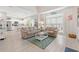 Open living room with a connecting kitchen, comfortable seating, bright windows, and light flooring at 503 20Th Ave. N # 55B, North Myrtle Beach, SC 29582