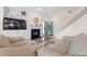 Inviting living room featuring comfortable sofas, a modern fireplace, built-in shelving, and ample natural light at 503 20Th Ave. N # 55B, North Myrtle Beach, SC 29582