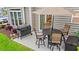 This patio has outdoor seating, a grill, manicured landscaping, and a sliding door to the home at 503 20Th Ave. N # 55B, North Myrtle Beach, SC 29582