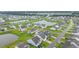 An aerial view shows a vibrant community with lush greenery, serene ponds, and well-maintained homes at 5031 Vinesia Dr., Myrtle Beach, SC 29579