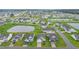 An aerial view of a lovely residential area with ponds, green lawns, and neatly arranged houses in a suburban setting at 5031 Vinesia Dr., Myrtle Beach, SC 29579