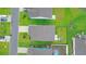 Bird's-eye view showing home rooftops, a pool, green lawns and a street full of parked cars in a well-planned neighborhood at 5031 Vinesia Dr., Myrtle Beach, SC 29579