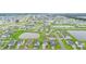 Aerial view of a community with houses lining water features, lush green lawns, and well-maintained landscaping throughout the neighborhood at 5031 Vinesia Dr., Myrtle Beach, SC 29579