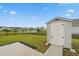 Backyard with new shed, black fence, and view of neighborhood pond at 5031 Vinesia Dr., Myrtle Beach, SC 29579