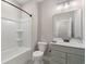 Bathroom featuring a tub shower combination, single vanity, and patterned tile floors at 5031 Vinesia Dr., Myrtle Beach, SC 29579