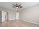 Serene bedroom with light wood floors and neutral tones, offering a tranquil retreat with ceiling fan at 5031 Vinesia Dr., Myrtle Beach, SC 29579