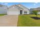 Charming single-story home with a well-manicured lawn and a two-car garage at 5031 Vinesia Dr., Myrtle Beach, SC 29579