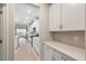 Gourmet kitchen featuring sleek white cabinets, countertops, and a stylish backsplash for a modern look at 5031 Vinesia Dr., Myrtle Beach, SC 29579