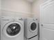 Bright laundry room featuring new washer and dryer, plus wire shelving at 5031 Vinesia Dr., Myrtle Beach, SC 29579