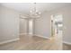 Spacious living area featuring hardwood floors and stylish lighting fixtures at 5031 Vinesia Dr., Myrtle Beach, SC 29579