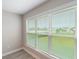 The bedroom window offers bright natural light and views of the home's beautiful landscaping at 5031 Vinesia Dr., Myrtle Beach, SC 29579