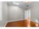 Bright bedroom with wood floors features a skylight and an ensuite bathroom at 505 Beaty St., Conway, SC 29526
