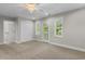 Well-lit bedroom with carpet flooring, ceiling fan, and door leading to balcony view at 505 Beaty St., Conway, SC 29526
