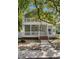 Charming two-story home with a inviting porch, landscaped yard and a large tree providing shade at 505 Beaty St., Conway, SC 29526