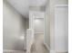 Hallway with carpet, white walls, baseboard, stairs, and views of the bedroom through the doorway at 505 Beaty St., Conway, SC 29526