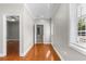 Entry hall boasts hardwood floors, a window and lots of natural light at 505 Beaty St., Conway, SC 29526