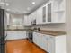 A spacious kitchen features ample counter space, stainless steel appliances, and hardwood flooring at 505 Beaty St., Conway, SC 29526