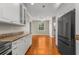 Open kitchen with stainless steel appliances and views into adjacent living area at 505 Beaty St., Conway, SC 29526