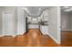 Bright kitchen features white cabinetry, stainless steel appliances, and hardwood floors at 505 Beaty St., Conway, SC 29526