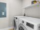 Clean laundry room with modern washer and dryer, plus handy shelving at 505 Beaty St., Conway, SC 29526