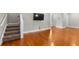 Bright, spacious living room featuring hardwood floors, recessed lighting, and stairs at 505 Beaty St., Conway, SC 29526