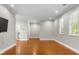 Bright, spacious living room featuring hardwood floors, recessed lighting, and abundant natural light at 505 Beaty St., Conway, SC 29526