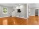 Bright, spacious living room featuring hardwood floors, recessed lighting, and stairs at 505 Beaty St., Conway, SC 29526