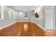 Bright, spacious living room featuring hardwood floors, recessed lighting, and abundant natural light at 505 Beaty St., Conway, SC 29526