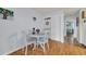 Bright dining area features wood floors, a white table, and a stacked washer and dryer closet at 510 Fairwood Lakes Dr. # 923G, Myrtle Beach, SC 29588