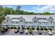 Exterior view of a two-story condo building featuring light blue siding, a gray roof, and well-maintained landscaping at 510 Fairwood Lakes Dr. # 923G, Myrtle Beach, SC 29588