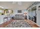 Bright living room with hardwood floors and an open floor plan connected to the kitchen and an outdoor patio at 510 Fairwood Lakes Dr. # 923G, Myrtle Beach, SC 29588