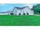 Lush backyard featuring a well-maintained lawn and the home's exterior at 548 Fox Chase Dr., Conway, SC 29527