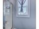 Bright bathroom with light blue walls and a glass shower with a view to the exterior at 548 Fox Chase Dr., Conway, SC 29527