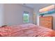 Cozy bedroom with a wood dresser, television, and bright light from the exterior window at 548 Fox Chase Dr., Conway, SC 29527