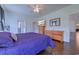 Bright bedroom with wood dressers and wood-look flooring with a television and ceiling fan at 548 Fox Chase Dr., Conway, SC 29527