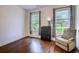 Spare bedroom with a dark dresser, arm chair, and two large windows providing plenty of natural light at 548 Fox Chase Dr., Conway, SC 29527