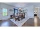 Dining room featuring a wooden table, seating for six, stylish decor, and an exterior door at 548 Fox Chase Dr., Conway, SC 29527