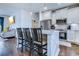 Bright kitchen with white cabinets, a center island with seating, stainless steel appliances, and hardwood flooring at 548 Fox Chase Dr., Conway, SC 29527