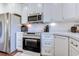 Modern kitchen featuring stainless steel appliances, white cabinetry, and stylish countertops at 548 Fox Chase Dr., Conway, SC 29527