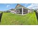 Exterior view of the screened-in porch and fenced backyard showing the outdoor living space at 553 Pier Ct., Longs, SC 29568
