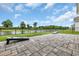 Spacious backyard with a beautiful pond view and paver patio that is perfect for outdoor activities at 553 Pier Ct., Longs, SC 29568