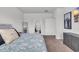 Well-lit bedroom with carpet, a comfortable bed, dresser, mirror and artwork at 553 Pier Ct., Longs, SC 29568