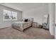 Serene bedroom with neutral tones, a comfortable bed, and a bright window view at 553 Pier Ct., Longs, SC 29568