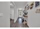 Inviting hallway features lovely decor, beautiful floors, and light neutral paint at 553 Pier Ct., Longs, SC 29568