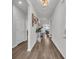 Inviting hallway features lovely decor, beautiful floors, and light neutral paint at 553 Pier Ct., Longs, SC 29568